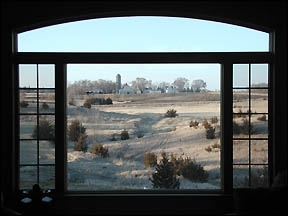 Window with view of old farmstead