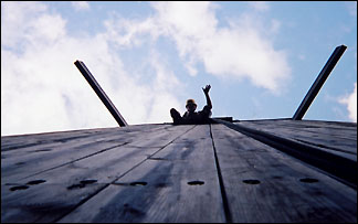 Eagle Scout on top of climbing wall