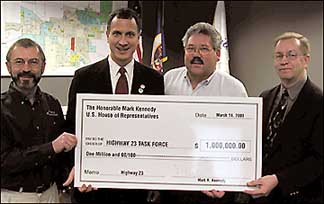 Congressman Kennedy presenting check