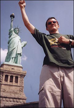 Adam Ingalsbe poses as though he himself were the statue of liberty