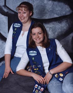 Heidi Steinhofer and Mindy Meagher pose with their Girl Scout vests