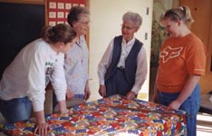 Meagher and Steinhofer with Grace United Methodist Church quilting ladies
