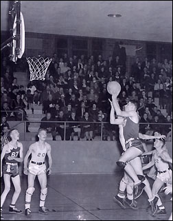Hall of Famer Bud Olsen playing basketball