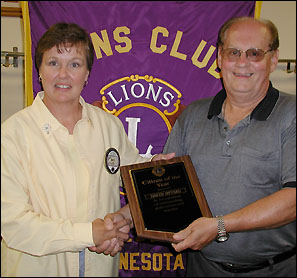 Barb Elseth presenting David Stumo with a plaque