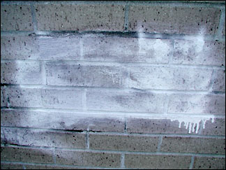 Spray-painted brick wall
