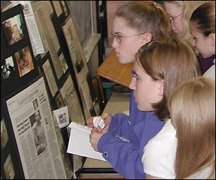 Kids reading papers