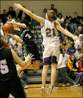 Kim Hess shoots over the Albany defender