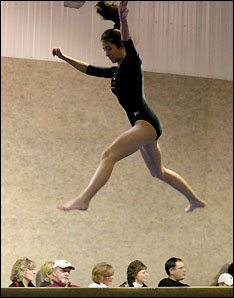 Abby Jumping on beam