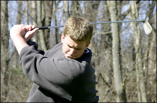 Mitchell hitting the golf ball