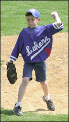 Nephew Nick Hemmesch throws out the first pitch