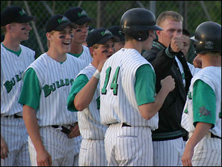 Highfives all around after a fourth inning score