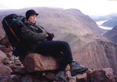 Linda relaxing on a rock