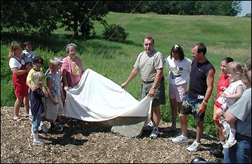 the trail dedication marker is revealed