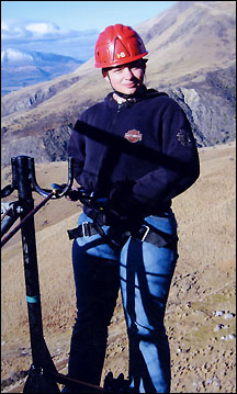 Jen Terres climbing down cliff