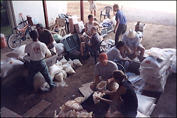 Evangelical Free Church member held sort food for distribution in Nicaragua