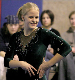 Ashley poses on the floor exercise