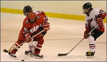 Girls fight for the puck